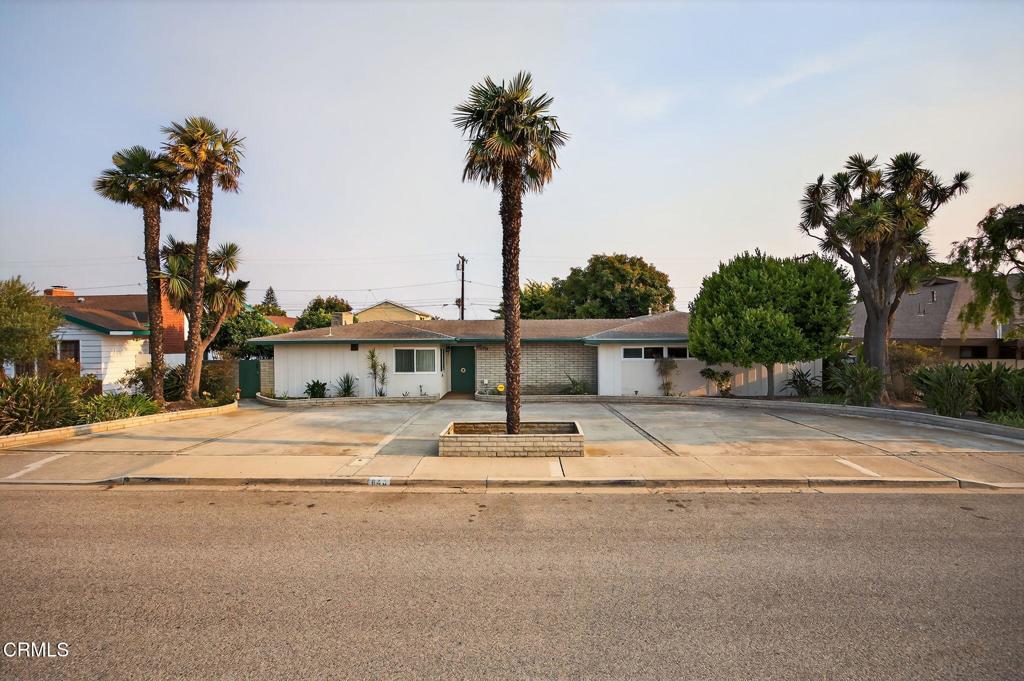 Walk back into the 1950's in this mid-century custom North Oxnard Home. Built in 1959-Assessor's roles show 2727 sq. ft. single story on a 11,325 sq. ft. lot, 4 bedrooms, 2 1/2 baths. 4th bedroom is a 'Jack and Jill'setup with two closets, add a wall in between and make it 5 bedrooms. Additional 411 sq. ft in an enclosed breezeway connected to a 814 sq. ft. three car garage. Large family room with a cathedral beam wood ceiling, fireplace with gas logs and a entertainment bar. Low maintenance yards, patios and no grass. Several fruit trees in a side yard and a large hass avocado tree. Separate RV parking off the alley and more parking with a circular front entry drive. One block walk to schools, church and a park.