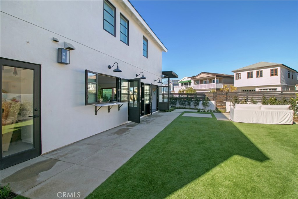 Completely rebuilt home just steps to the sand in Newport Shores WITH A YARD on nearly a double lot. High qualify finishes throughout. Chefs kitchen with pass through bar to the outside where you will find the lawn and outdoor fire. La Cantina doors that open nearly 20 feet wide to the patio with built in BBQ. Classic Southern California indoor/outdoor living. Newport Shores Community Association with pool, tennis court, basketball court, sand volleyball, bbq's, etc.
Master suite features a built in office, oversized master bath with soaking tub and walk-in closet.