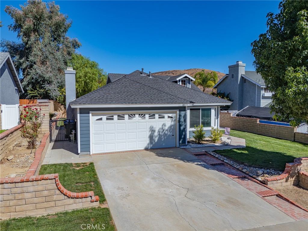 Welcome to this beautifully maintained single-story home in the heart of Castaic! Featuring three bedrooms, two full baths, and 1,319 square feet of living space, this home perfectly blends comfort, style, and convenience.
Inside, you’ll find an open kitchen, a living room with vaulted ceilings and abundant natural light, a separate dining area, and a cozy gas fireplace. Upgraded flooring, contemporary kitchen with upgraded appliances, and fresh interior and exterior paint create a move-in-ready feel.
The spacious primary suite opens to the backyard for seamless indoor-outdoor experience. One guest bedroom features charming paneling and crown molding. Additional highlights include dual pane windows, a Nest thermostat, central HVAC, and recent roof and siding updates.
The private backyard oasis boasts a sparkling pool, functional water fountain, and updated systems including a newer pump, filter, and safety gate. Enjoy mountain views, a new side gate, and a patio set perfect for entertaining.
Conveniently near the I-5, this home offers easy access to Santa Clarita, Valencia Town Center, Six Flags Magic Mountain, and the San Fernando Valley. Outdoor enthusiasts will love near you Castaic Lake, parks, and hiking trails. Located in the top-rated Castaic Union and William S. Hart Union School Districts, this home is ready for your private tour!