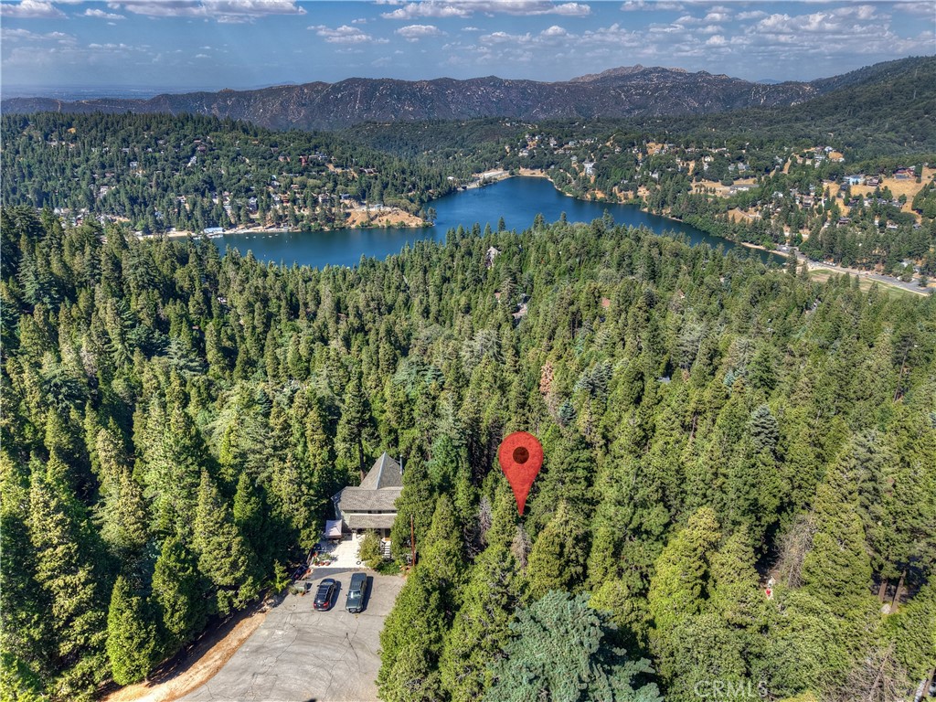 Seller financing may be available with agreeable terms ~ Build your mountain getaway in Crestline, California ~ This is a 14,320 square foot triangular lot in a cul-de-sac ~ Located just minutes from Lake Gregory, hiking trails, and loads of outdoor recreation ~ This down-sloped lot offers potential for street-level parking and access, along with views of Lake Gregory ~ Take in the fresh mountain air, year-round beauty, and experience a true sense of retreat ~ Bring your vision to life - your canvas in this San Bernardino mountain community awaits! No address has been assigned to this property.