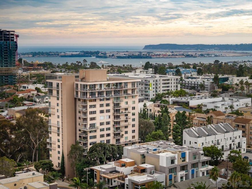 What a great find that won't last a second! Centrally located in the Balboa Park/Hillcrest communities in the Coral Tree Plaza. Central to restaurants, shopping, freeways, the airport, and downtown. The condominium is in turn key condition offering a spacious balcony with canyon and Balboa Park Views, Hardwood wood floors in the Living Room/Dining combination, new stainless  kitchen appliances with a sit down bar/dining area, spacious primary bedroom with views and new plush carpet, enormous walk-in closet, interior laundry hook-ups for a stacked washer and dryer, nice vanity area with plenty of linen space and private bath, desirable amenities with tennis, pool/spa and club house, Dog Park and TWO underground parking spaces which is a rarity.