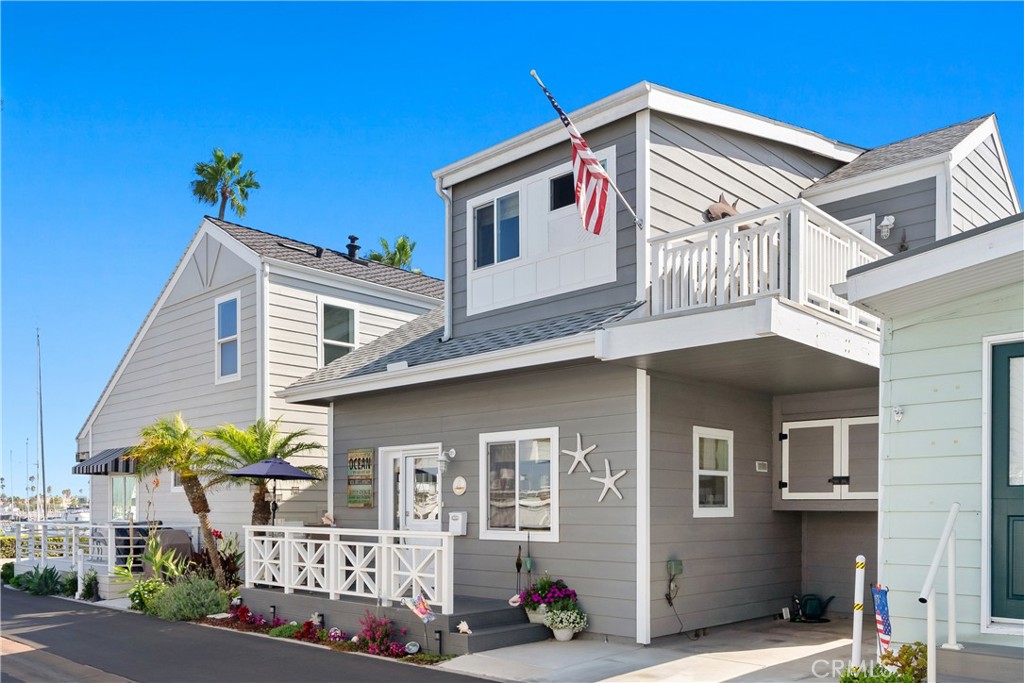 Coastal charm meets turnkey living in this beautifully maintained 2 bed, 2 bath home in the desirable Lido Peninsula Resort. Just one home away from the community’s private beach, this rare offering features peekaboo water views and thoughtful upgrades throughout.
Highlights include engineered oak hardwood floors, granite countertops, and a recently remodeled downstairs bath with organic tile and walk-in shower. Custom touches like seagrass blinds, white-lined linen curtains, and a mahogany wine rack in the walk-in pantry add warmth and character.
Enjoy modern convenience with full-sized washer/dryer, air conditioning, upgraded electrical, and high-gloss paint throughout. Marine-grade exterior railings, fiber board decking, and custom carport storage ensure durability and style.
Disappearing screens and a Dutch door bring the ocean breeze in. Neutral palette, single-owner pride, and just steps to the sand—this is effortless coastal living at its best.
Enjoy resort-style amenities and the best of coastal living in one of Newport Beach’s most desirable waterfront communities. Resort-style amenities include a private beach, a refreshing pool and hot tub heated year round, a clubhouse for social gatherings, and a state-of-the-art gym. Beyond the confines of this resort-like community, the wonders of Newport Beach await. A short distance away, discover the pristine sands of the beach and indulge in retail therapy at Lido Marina Village. Easy access to world-class dining at renowned establishments like Nobu, Cannery, Malibu Farms, and more. In a realm where privacy, luxury, and convenience converge, this residence stands as a beacon of coastal perfection. Don't miss the chance to call this haven your home—where every moment is a celebration of life on the Lido Peninsula. Land Lease of $3,808/Mo. Ask about our low property taxes.