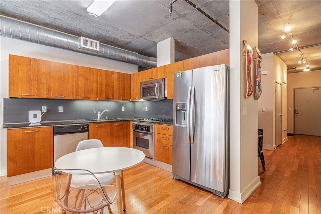 Photo of 645 W 9th St #301, Los Angeles, CA 90015 (MLS # IV25259809)