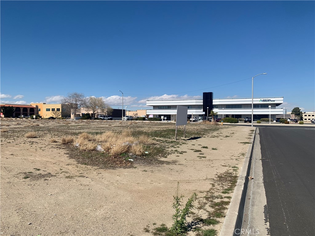 ±0.56 acres of unimproved commercial land for sale on the corner of Sage St & Cajon Ave in Victorville; APN: 0396-154-06. Zoned Civic Business Center under the Civic Center Specific Plan, this lot will permit for the development of professional office and associated retail/service uses serving the neighboring government/service districts. Water, sewer, and power are all at site. This property is located in a Qualified Economic Opportunity Zone and may be eligible for preferential tax treatment. Neighboring businesses include Victorville City Hall, Victorville Superior Court, InterCon Security, Mojave Desert Air Quality Management District, The Woodall Group, and more. Buyer to verify all information contained herein. Agent and their representatives are not responsible for the accuracy of these claims.