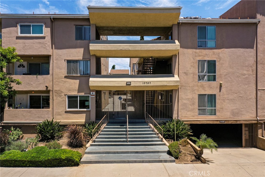 This welcoming, comfortable home is located in the desirable Toluca Lake/NoHo Arts District. This unit at 10757 Hortense St is a two-bedroom, two-bathroom condominium. The condo offers a spacious, light, and bright interior with a functional layout. It is a convenient first-floor unit within a secure, well-maintained building. The home has been partially updated and features a functional galley kitchen and a spacious living room. The primary bedroom includes an ensuite bathroom and a spacious walk-in closet. There is also a generously sized second bedroom and an updated second bathroom. The complex provides residents with a sparkling swimming pool, a spa, and several community laundry rooms. Gated, subterranean parking is available with two tandem spots and space for a storage bin. This home is an embodiment of comfortable living, located close to major studios such as Warner Bros., Disney, and Universal, and just minutes from Universal City Walk. The vibrant NoHo Arts District is easily accessible, offering numerous theaters, galleries, and restaurants.