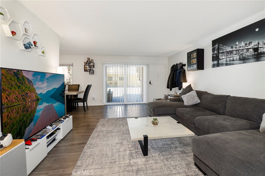 PRICE REDUCED!! This welcoming, comfortable home is located in the desirable Toluca Lake/NoHo Arts District. This unit at 10757 Hortense St is a two-bedroom, two-bathroom condominium. The condo offers a spacious, light, and bright interior with a functional layout. It is a convenient first-floor unit within a secure, well-maintained building. The home has been partially updated and features a functional galley kitchen and a spacious living room. The primary bedroom includes an ensuite bathroom and a spacious walk-in closet. There is also a generously sized second bedroom and an updated second bathroom. The complex provides residents with a sparkling swimming pool, a spa, and several community laundry rooms. Gated, subterranean parking is available with two tandem spots and space for a storage bin. This home is an embodiment of comfortable living, located close to major studios such as Warner Bros., Disney, and Universal, and just minutes from Universal City Walk. The vibrant NoHo Arts District is easily accessible, offering numerous theaters, galleries, and restaurants.