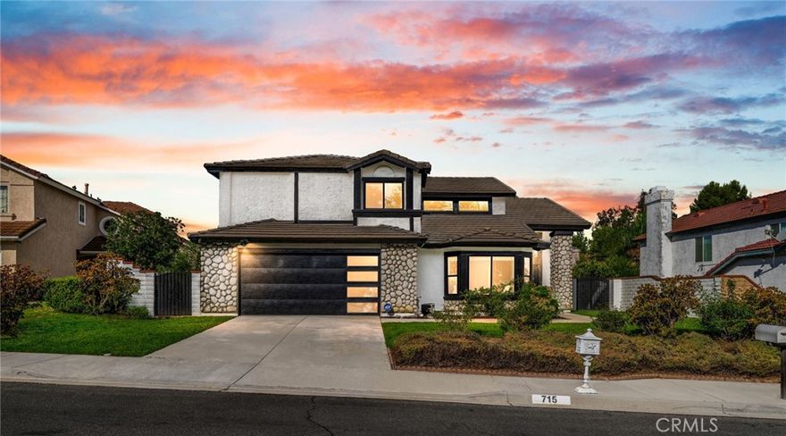 Step into a beautifully renovated home where every detail has been thoughtfully designed for style, comfort and convenience. This home blends modern design with energy efficiency, creating a rare opportunity that's truly move in ready. You are greeted with a new double entry door that leads right into a spacious open-concept layout filled with abundant natural light creating a bright and inviting atmosphere. Enjoy a modern kitchen with quartz counters, waterfall breakfast bar, and new appliances. Bathrooms are fully renovated with upgraded plumbing. Additional highlights include new dual tone windows, recessed lighting, luxury vinyl plank flooring, and custom fireplace surround. A new contemporary garage door with epoxy flooring, a new electrical panel solar ready and Tesla Universal EV charger. Outdoor living shines with a new paver patio with matching garden wall with accent lighting, a new Rachio irrigation system that automatically optimize watering to maintain a healthy lawn. This stunning home has both beauty and functionality and is ready for its next chapter!
