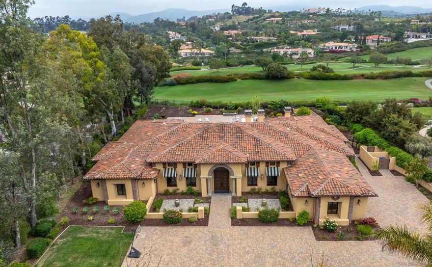 Enviably set in the highly sought-after Rancho Santa Fe Farms gated golf community, this phenomenal 6-bedroom estate offers the ultimate privacy and fine living! Bordered by manicured fairways and lush landscaping, the inviting retreat takes inspiration from its natural surroundings. Sweeping single-level design showcases high ceilings with beams and gorgeous travertine floorings. Elegant archways connect dinning area to the open-concept kitchen that highlights gleaming granite countertops and stainless steel appliances.