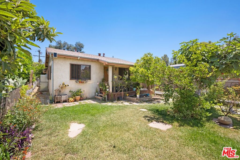 Discover the potential of 231 South Avenue 58, a unique offering located in Highland Park's Historic Preservation Overlay Zone (HPOZ). This versatile compound includes a 2 bed / 2 bath main house, a detached 2-car garage with a rear 1 bed / 1 bath unit, and an additional storage structure. Inside the main residence, you'll find a bright living room, dining room, and a fully equipped kitchen with ample cabinetry, along with two comfortable bedrooms each featuring their own ensuite bath. The lush front yard offers fruit trees, native landscaping, and a thriving vegetable garden, along with ample driveway parking. Just moments from Highland Park's popular restaurants, coffee shops, and boutiques, this home offers a rare opportunity in a vibrant and culturally rich neighborhood. This is a probate sale requiring court confirmation. (Please note some photos are virtually staged).