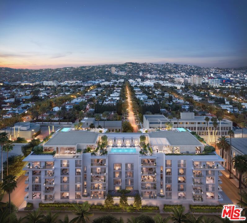 A harmonious blend of privacy and indulgence, Mandarin Oriental Residences, Beverly Hills offers the intimacy of a private home enhanced by the legendary service of a five-star hotel. Designed in collaboration with internationally acclaimed 1508 London, each residence is a master class in refinement, where daily rituals are elevated into moments of quiet luxury. The rooftop is a sanctuary unto itself, with sweeping views of Beverly Hills' iconic palm-lined streets. Surrounded by citrus trees and fragrant plantings of lavender, rosemary and sage the rooftop oasis features a heated pool, towel service, and serene lounge areas infused with calming natural scents. Wellness offerings continue with an impeccable spa suite featuring private treatment rooms, a steam room and sauna, and a state-of-the-art fitness center with Technogym equipment, private ballet/yoga room, and a sunlit outdoor terrace overlooking Century City and the pool. On the ground level, residents enjoy access to a private boardroom and cozy fireplace lounge, perfect for entertaining or working from home in style. Around-the-clock valet, concierge, and residence services ensure every detail is handled with signature Mandarin Oriental grace and discretion. Featuring a gracious two-bedroom layout with tranquil northeast exposures and a formal entry leading into a loft-like Great Room that flows effortlessly to a private treetop terrace. The open chef's kitchen is anchored by a leathered Taj Mahal quartzite peninsula, perfect for casual dining or entertaining. The en-suite guest bedroom overlooks the lushly landscaped Palm Court, while the serene primary suite offers a generous walk-in closet and five-fixture bath designed for total relaxation.
