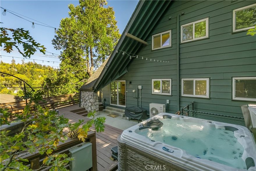 Escape to your dream getaway in this stunning 5-bedroom, 3-bathroom home just a short stroll from the lake, boasting 2171 sq ft of luxurious living space with bags of character. Enjoy spectacular lake views from your private dock, where you can soak up the sun, host BBQs, and watch the July 4th fireworks light up the night sky with friends and family. Nights like this are hard to beat when the surrounding mountains transform into a twinkling canvas of lights, creating a truly enchanting atmosphere like a magical scene from a children’s storybook. This is Lake Arrowhead living at its absolute best where memories can be made and never forgotten. This home perfectly blends cool cabin vibes and rustic mountain charm, offering ultimate comfort and style. With dual system AC, chic furnishings, and decor, you'll feel right at home. The expansive deck features multiple fire pits and a hot tub, perfect for relaxing and taking in the breathtaking views. The master bedroom boasts stunning lake views, making it the perfect retreat. Located on a quiet, county-maintained street in a prestigious Lake Arrowhead area, this property offers the ultimate lake lifestyle. Don't miss out on this rare opportunity to own a piece of paradise! Dock available for purchase with first right of refusal to the buyer.
