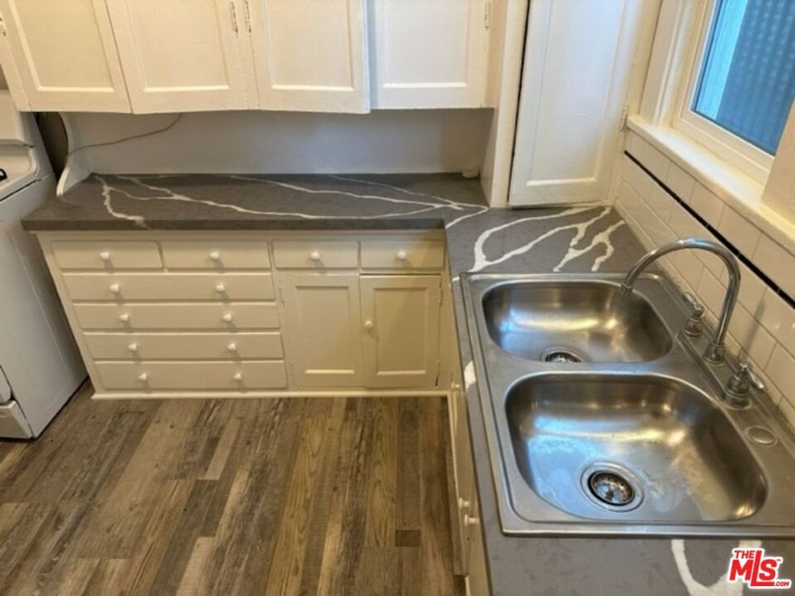 Prime LOCATION! Spacious remodeled downtown one bedroom apartment only 1.1mile to the beach and walking distance to historic Pine Ave. Vintage unit features NEWER plank flooring, newer kitchen quartz countertops, newer windows and window A/C, newer fixtures, crown moldings, two-tone paint, full-size bathroom with separate shower and bathtub. Ground floor unit also includes a stove, refrigerator and service porch that leads to shared backyard grass area. Water, gas, electric and trash paid by Landlord. One small pet less than 30lbs considered for $50 monthly. Complex has entry security door, fencing, gates and is walking distance to mass transit/Metro rail line, two laundromats, grocery store, restaurants, bike trails, banks, churches, schools, wine bars, breweries and more. Eleven month lease required. Please visit onsite property flier box for Open House schedule or contact Agent by email and text for viewing appointments. Landlord will process all applications, credit and eviction checks at a $45 per adult applicant rate. No eviction history. No onsite parking. No laundry. Public street parking and potential parking stalls available at next door Church.  HURRY, WON'T LAST!