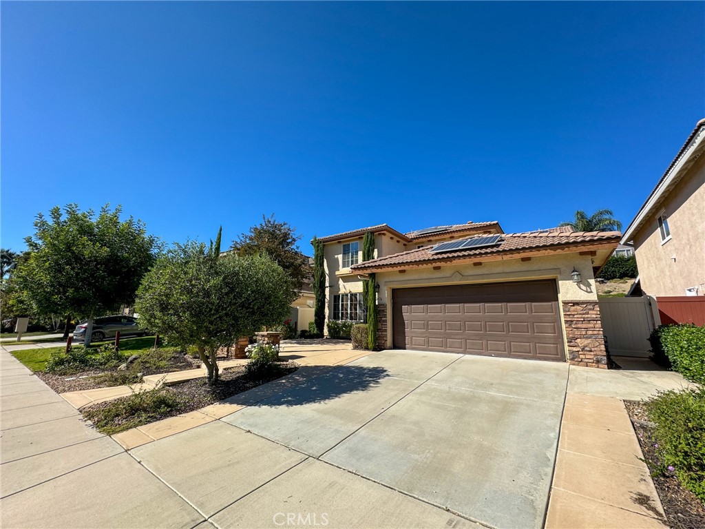Welcome to this beautifully upgraded 4-bedroom, 3-bathroom pool home, built in 2020 and nestled in the highly sought-after Paseo Del Sol community of Temecula. Boasting just under 2,300 square feet of stylish living space, this home offers the perfect blend of modern comfort and resort-style amenities—complete with a custom Pebble Tec pool and spa, and a spacious tandem 3-car garage. Step inside to discover a bright and versatile layout. Off the entry, you'll find a large flex room ideal for a formal living area, media room, home office, or playroom. The open-concept kitchen is a true chef’s delight, featuring crisp white cabinetry, elegant Corian countertops, a stylish backsplash, a large center island, and seamless flow into the dining area and family room. The family room is anchored by a cozy fireplace with a rustic wood mantel—perfect for cool evenings. Just off the kitchen is an additional bonus room, ideal for a home office or even a potential fifth bedroom. Thoughtful touches throughout the home include a convenient mudroom-style entry from the garage with a built-in chalkboard wall and hooks—perfect for busy families. Downstairs also features a full bathroom with a walk-in shower and ample under-stair storage. Upstairs, you'll find a generously sized laundry room with storage cabinets and a sink. The spacious primary suite is a serene retreat, complete with a ceiling fan, dual vanities, a soaking tub, separate shower, and a large walk-in closet. Additional bedrooms are well-proportioned and share a well-appointed full bathroom. Step outside to your private backyard oasis—designed for relaxation and entertaining. Enjoy the custom Pebble Tec pool and spa, a covered patio adorned with string lights, lush landscaping, and a raised patio area perfect for lounging or dining al fresco. Located in the desirable Paseo Del Sol community, residents enjoy access to resort-style amenities including an Olympic-sized pool, clubhouse, fitness center, parks, playgrounds, tennis courts, basketball courts, and more. Don’t miss your chance to own this incredible home—schedule your private showing today!