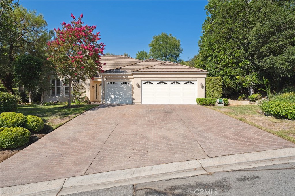 Located in North Ranch Westlake Village in highly desirable Crescent Oaks neighborhood. This 4 bedroom 2.5 bathroom house nearly 2,800 square feet is a single story home that offers exceptional potential for the next owner to personalize and make their own. With wonderful layout and timeless design, the property will check off all the boxes. The inviting floor plan features a light filled living room with a cozy fireplace and direct access to the backyard. The kitchen and dining areas provide ample space for gathering, while multiple sliding doors create a seamless flow between indoor living and the private outdoor retreat. The backyard, set on nearly 23,000 square feet lot, boasts a pool and spa surrounded by mature landscaping along with privacy. With generous patio space, it is an ideal setting for entertaining or simply relaxing in the peaceful surroundings. The home offers generously sized bedrooms, including a spacious primary suite with high ceilings, a large walk in closet, and an en suite bath. Additional bedrooms are well proportioned and filled with natural light.Combining location, lot size, and layout, this is a rare opportunity in one of Westlake Village’s most sought after communities. Welcome to your next chapter in Crescent Oaks.