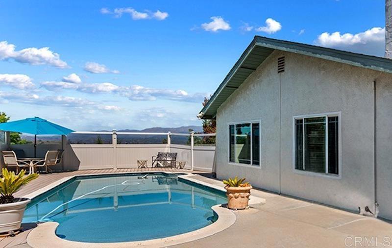 Set against gentle rolling hills, this single-story Fallbrook home offers peaceful views, plenty of space, and easy access to everything the village has to offer. The oversized lot includes a sparkling pool, an above-ground spa, and a detached studio—surrounded by low-maintenance landscaping and room to spread out. Energy efficiency is a standout feature, with 49 owned solar panels and two Tesla batteries powering the home, dramatically reducing utility costs. Additional recent upgrades include energy-efficient windows and roof shingles, GFCI outlets, a new pool pump and filter, improved pool and deck lighting, replaced heating ducts, a dedicated A/C unit in the studio, and a new central air and heating system for year-round comfort. A path lined with succulents leads to a sunny front patio. Inside, the living room is filled with natural light from large windows and flows easily into the dining area, where sliding doors open to a shaded side patio—perfect for morning coffee or casual outdoor dinners. The kitchen, just off the dining area, features stainless steel appliances, a gas cooktop, and a breakfast bar for everyday meals or easy entertaining. Down the hall, the primary suite includes mirrored closets and an updated bathroom with a walk-in shower and modern vessel sink. Two more bedrooms and a full bath complete the main home. Above the garage, a bright and flexible studio with its own half bath offers great potential as a guest space, home office, or rental unit. The backyard is made for enjoying the outdoors—swim in the pool, relax in the spa, garden, or simply take in the view. A detached shed offers extra storage, and there's space for RV parking, too. Just minutes from downtown Fallbrook’s shops, cafés, and local favorites—and a quick drive to Highway 76 and I-15—you’re within easy reach of Temecula, Escondido, and the beaches of Oceanside and Carlsbad. Parks, schools, and a quiet, low-traffic neighborhood add to the comfort, while local events like the Avocado Festival, Hot Summer Nights, and year-round art and cultural gatherings give Fallbrook its small-town charm.