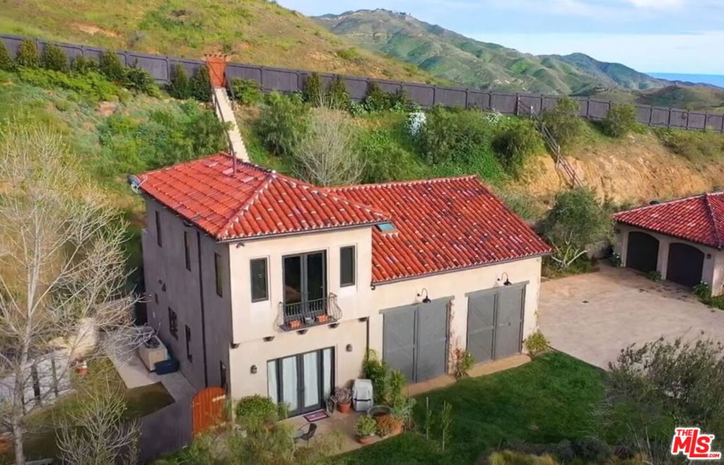 Fully furnished Santa Barbara style guesthouse with mountain views and amazing sunsets looking west on a Malibu estate. Features 3 bedrooms, 2 bathrooms, kitchen, family room, office, outdoor patio with BBQ, and rear yard. High-end finishes throughout including hardwood floors, 11' ceilings in the living room, and washer/dryer in unit. Separate entrance from the main house with 2 parking spaces with 2 guest spaces. WiFi, water, and electricity. Tenant pays trash and propane. Just 7 minutes up Encinal Canyon from PCH, 7 minutes to Broad Beach, and 12 minutes to Westlake Village Caruso Mall. $5,100/month 1-year lease. Call agent for more information.