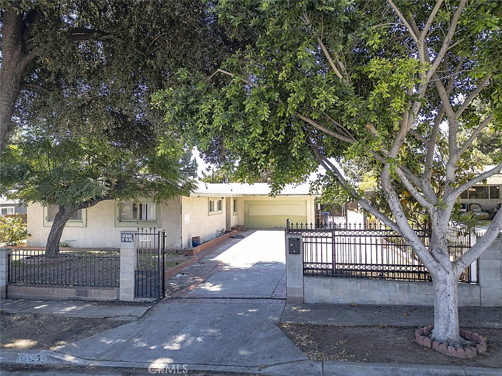 Fixer opportunity in Sylmar! Welcome to this charming Sylmar home, featuring 3 bedrooms and 2 bathrooms, offering comfort and functionality for today's lifestyle. In addition, the garage has been thoughtfully converted into a 2 bedroom, 1 bath, providing extra living space. The interior features 1,350 square feet of living space with a bright layout that welcomes natural light. The kitchen includes ample cabinet and counter space, and the home offers flexibility for both quiet enjoyment and entertaining. Situated on a spacious 7,497 square foot lot, the backyard includes mature landscaping and plenty of room for outdoor relaxation or gatherings. The property offers a large private driveway with plenty of parking and is fully gated for added privacy and security. Welcome Home!