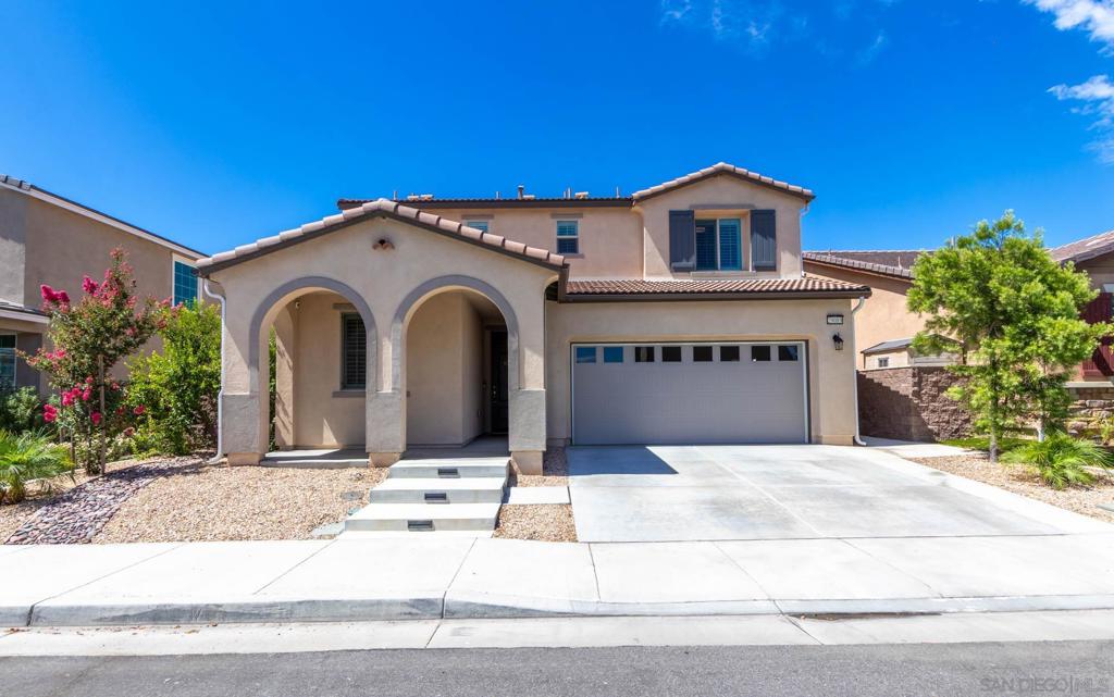 Welcome to this beautifully maintained 4-bedroom, 3-bath detached home in the scenic hills of Lake Elsinore. Built in 2021 and offering 1,929 sq ft of thoughtfully designed living space, this home showcases pride of ownership with a clean, well-kept interior and modern finishes throughout. Enjoy breathtaking views of the surrounding mountains and reservoir, with added privacy thanks to no rear neighbors. One bedroom is conveniently located downstairs, ideal for guests or multi-generational living. The low-maintenance backyard features turf and a stylish pergola with built-in fans and shade covers—perfect for relaxing or entertaining. Additional features include a leased solar system for energy efficiency, a spacious 2-car garage, and access to great community amenities. This is Southern California living at its best—comfort, convenience, and natural beauty all in one.