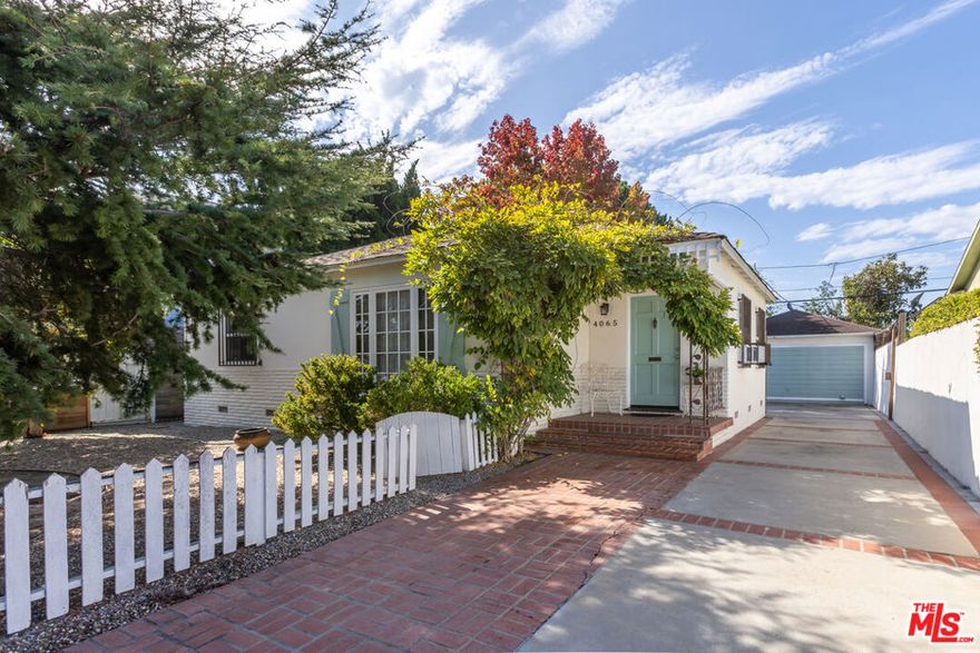 An incredible opportunity awaits whether you're seeking a charming character-filled home or a prime development lot among new construction. Set on a desirable 5,501-square-foot lot with a 50.47-foot frontage along a tree-lined street, this property offers endless potential in a sought-after neighborhood near the Marina, Marina Marketplace, and all of its premier shopping, dining, and lifestyle amenities. This enchanting residence exudes warmth and charm with its gleaming oak hardwood flooring, Spanish tile accents, wainscoted walls, and custom paint palette. Step into an inviting foyer that leads to the main living area featuring an expansive picture window, a decorative freestanding fireplace with an artistic mantle, and a beautifully designed accent wall that serves as a focal point.The heart of the home is a sunlit kitchen showcasing white shaker cabinetry, Spanish tile countertops and backsplash, a stainless-steel dishwasher and stove, and two bright windows that fill the space with natural light. Two well-sized bedrooms complete the interior. Bedroom One highlighted by cream-colored wainscoted walls, crown molding, plantation shutters, and direct access to the rear yard, and Bedroom Two offering a serene, neutral color scheme with generous storage and natural light. The vintage-style bathroom features a tiled tub/shower combination, pedestal sink, mirrored medicine cabinet, and glass shelf. Outdoors, the property continues to delight with a rear brick porch, large patio, and spacious backyard shaded by mature trees plus a coveted detached bonus structure ideal for dining, entertaining, a studio, or creative workspace.Whether you envision restoring this home's original charm or designing and building your dream residence from the ground up, the possibilities are limitless. A rare find in a highly desirable Westside location, just moments from Marina del Rey, Venice Beach, and Santa Monica.