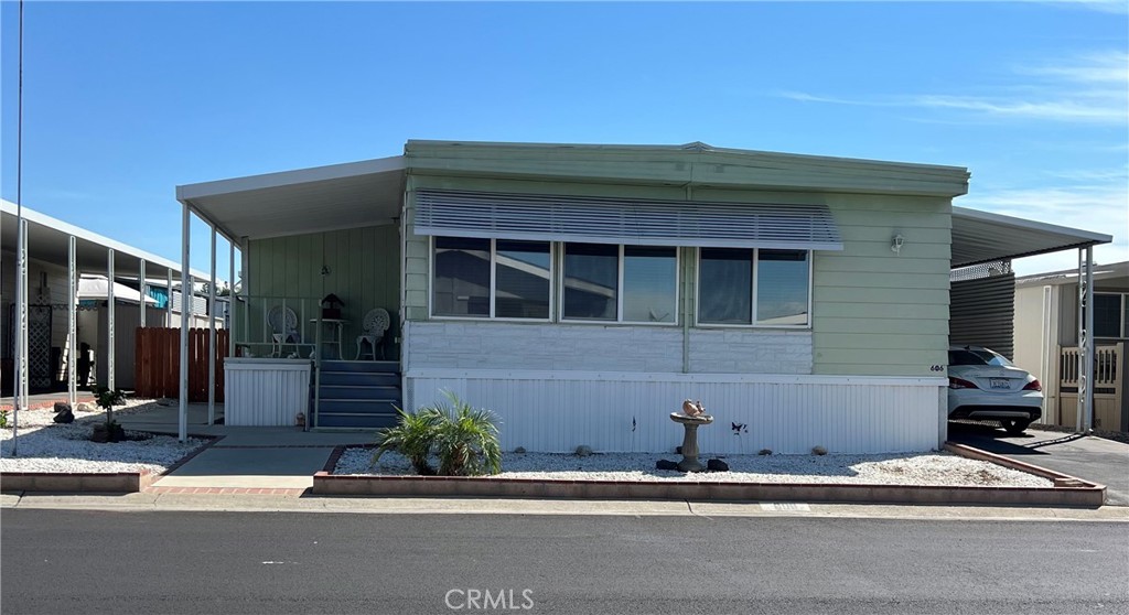 Beautifully Maintained Manufactured Home in a Five-Star Senior 55+ Community in La Verne. This spacious double-wide home (12’ x 60’, approx. 2,000 sq. ft.) is located in one of La Verne’s premier senior communities. It features an open-concept kitchen with a large center island, a formal dining room, and an expansive living room, making it perfect for both everyday living and entertaining. The home also offers an optional den or office, along with a combination of carpet and tile flooring in a modern panel style. White cabinetry and dual-pane windows provide abundant natural light throughout, the master bedroom with walk-in closet. Appliances such as the stove, oven, washer, and dryer are also included, making this well-kept home move-in ready and ideal for comfortable living within a highly desirable community. Recoded Roof 4 months ago!
Laundry Area w/ Gas & Electric Hookups, Central Air / Central Heat, Driveway. Community amenities, include swimming pool, gym, club house, library.
carport fit 4 cars.