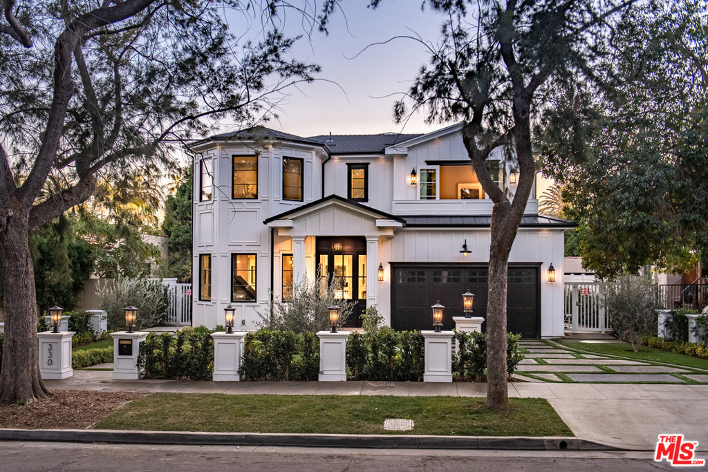 Enviable charm radiates from this brand new Cape Cod-inspired residence. Nestled in the desirable North of Montana Avenue enclave of Santa Monica, this 6-bedroom, 7,913 sq. ft. home is exceptionally inviting and design-forward with unparalleled craftsmanship, modern amenities, and the latest technology. A media room, wine cellar, as well as multiple fireplaces and dine-in wet bars provide the ideal scene for at-home leisure and entertaining. Oak floors guide one through the open concept living areas while Fleetwood pocket doors seamlessly welcome one out onto the spacious backyard and pool. The incredible chef's kitchen features an oversized Sub Zero Wolf range, coffered ceiling, butler's pantry, and custom tile backsplash complementing the home's classic, black-and-white color scheme. A lower level guest room and elevator adds functionality while the master suite enjoys treetop views from its private balcony on the third level.