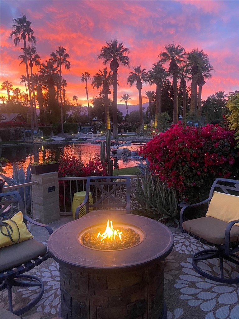 Welcome to The Lakes Country Club! This South-facing, waterfront, expanded Durango floorplan on one of the most popular streets in the community offers approximately 1,725 sq ft of living space. This home offers 1 primary suite, a den, currently utilized as a 2nd bedroom and a large office/ flex space with a beautiful large skylight. The extended patio with newer tile flooring provides an attractive outdoor living space to savor morning coffee or evening sunsets while enjoying the scenic water and panoramic mountain views. The expanded kitchen is nicely appointed with custom cabinets, granite countertops, a newer Wolf gas cooktop, built-in oven, warming drawer and microwave and a center island with seating for small gatherings. The list of upgrades doesn’t stop there: 14 owned solar panels 2.0 Net Metering, a welcoming paver driveway, plus the A/C and hot water tank were replaced in 2023. Wow, that’s a lot of value! This home is the perfect canvas, ready for your personal touch and style. Don’t miss your chance to own a gem in one of Palm Desert’s most desirable communities. The Lakes Country Club offers a robust schedule of social and fitness activities at the exquisite Clubhouse and Health and Wellness Center. Enjoy Tennis, Pickleball or Pop Tennis, Bocce or the 44 community pools and spas. For golfers, the Club offers membership options for the 27 hole championship golf course. Professional photos coming soon!