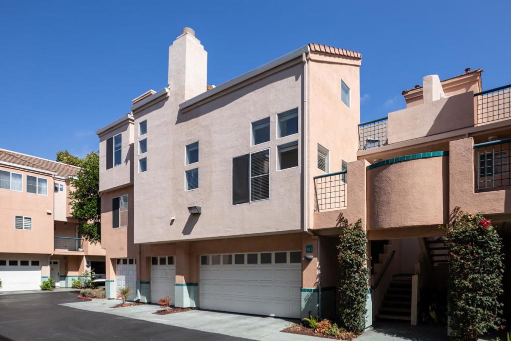 Beautiful 2 bedroom/2.5-bath townhome located in the gated Expressions community in Sunnyvale. This home offers a bright & open floor plan with high ceilings & plenty of natural light. The spacious living room features hardwood floors & a cozy fireplace, seamlessly connecting to the dining area & modern kitchen. The kitchen showcases light wood cabinetry, quartz countertops & range with 5-burner gas cooktop. You'll also find a convenient powder room & inside laundry area. Rounding out the main level is one of the two primary ensuite bedrooms complete with a walk-in closet, dual vanity & large stall shower. Upstairs, discover a versatile loft ideal as a home office, media space, or lounge area, along with access to a private balcony for outdoor relaxation. The second primary ensuite bedroom is also upstairs, featuring a walk-in closet, dual vanity & tub/shower. Additional features include central heating & air conditioning, and an oversized two-car garage. Community amenities include swimming pool, spa, clubhouse, playground, & beautifully landscaped grounds. Ideally located just moments from vibrant Downtown Sunnyvale with its array of shops, dining, & entertainment. Easy access to freeways, expressways, Caltrain, & nearby tech hubs. Top-rated schools, including Homestead High