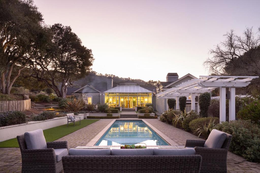 Located just around the corner from Carmel's famed Refuge Spa and the Carmel Valley Athletic Club, this beautiful 3-acre, Quail Meadows estate with lap pool, hot tub, and outdoor fireplace provides the perfect balance of indoor/outdoor living. With 4 bedrooms, 4.5 baths, and ~5222 sqft of light and bright living space, this stylishly designed home has a great floor plan and an effortless flow between rooms. The large gourmet kitchen is centered around a showcase island and breakfast bar, striking custom cabinetry, and high-end appliances. The living room and family room both feature stone fireplaces and vaulted ceilings, and with multiple skylights and a large sunroom, the whole house is flooded with warmth and light. The gated community offers a sense of exclusivity, security, and privacy, its location in Carmel Valley enjoys idyllic weather, and with all the incredible amenities of the Monterey Peninsula within a short drive, 5462 Quail Way is ready to welcome its next lucky owners.