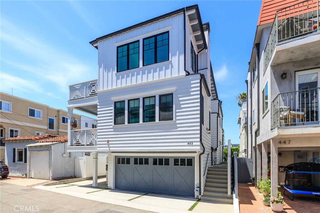 Beachy chic meets downtown cool...this one was built in 2018 by Tri West Development. It’s “better than new condition” gives you gorgeous stone, white oak hardwood floors, AC, designer wall paper, custom window coverings, automatic shades, great lighting, and surround sound. And guess what? This one sits on an oversized lot, 37.5’ wide! There's space on each floor for more of what you want and need. Let’s start at the top -the living area with 2 walls of folding glass doors, opening up to the big BBQ balcony for cooking and hanging out- dreamy indoor/outdoor living. The great room has a built-in wall of display shelving for all your cool stuff, surrounding a cozy fireplace. The huge family kitchen is the fave spot and the hub of this home. Everyone hangs around the huge marble island (breakfast seating too), and the chef & resident foodie will love the high-end Thermadore appliances: 6-burner + griddle and double oven, custom paneled refrigerator, microwave, beverage refrigerator, appliance garage, and walk-in pantry. Don’t miss the powder room with gorgeous grass cloth wall paper and stone sink. Let’s head downstairs through the shiplap detailed stairwell to 2 (of 3) bedrooms. The primary suite has it all with a huge bathroom, stand alone tub, spa sized shower, double sink vanity, walk in closet, and it all opens up to a southwest facing deck...ahhh. The second bedroom has an en-suite bathroom and lots of closet space. Now down to the first floor for our 3rd bedroom/office with built-ins, and en-suite bathroom. Lastly, feeling more like a house than a townhouse is a full laundry room/mud room area with washer, dryer, mud room type storage, and the first stop of the 3-stop elevator. The oversized lot affords you a bonus sized garage, has an EV charger, and space for 2 cars inside and a bonus area perfect for a Peloton/ gym area (no pressure but there is the space if you want it!). There’s an additional parking pad outside for your guests, and even more space for a golf cart or car in front of your garage, so you could get up to 4 car parking! You usually don’t get an elevator in a townhouse, but we have the room for it here. Whether you want to transport people or groceries, it’s easy. This sand section location is one of the most sought after areas in MB, with it’s 4 block proximity to the beach, parks and schools, and a few blocks more to our awesome Downtown. Pack your swimsuit and your espresso machine. Your year ‘round vacation begins here.