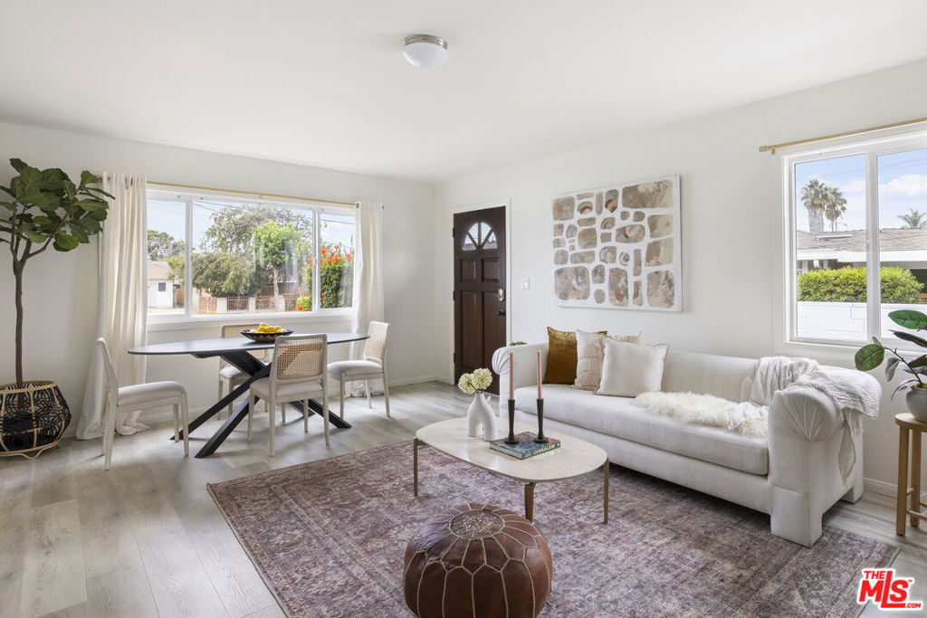 Charming remodeled home in a quiet, conveniently located neighborhood. Three bedrooms and one bathroom plus bonus room that could serve as a family room or additional bedroom. The spacious living room is bright and has plenty of natural light. The property has been tastefully and subtly remodeled throughout - kitchen has quartz countertops, great cabinet space and newer appliances incl washer and dryer. The bedrooms have ceiling fans and terrific closet space. Other features include a newer roof, electrical panel and very practical floorplan. The home is set back from the street, increasing privacy, with a large front yard. There is a lovely enclosed backyard - perfect for entertaining or quiet contemplation. Plenty of space for parking in the long driveway and detached two car garage. Close proximity to both east and west. An ideal place to call home.