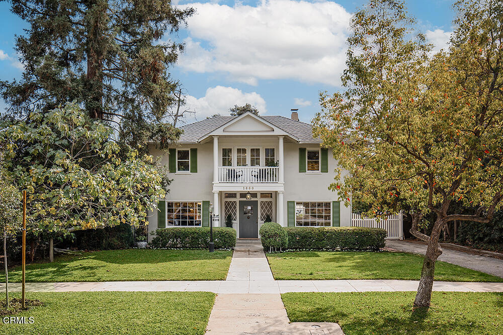This classic 1910 Southern Georgian Colonial with 4 bedrooms and 2 bathrooms is a standout in Pasadena's northeast Jefferson Park, Pasadena Heights neighborhood. With hardwood floors throughout, the home boasts a welcoming formal entry area with an original two-sided staircase and unique banister beckoning you upstairs.To the entry's left a traditional living room with a large front window, fireplace and built-ins. To the right of the entry an oversized dining room with stately charm. Through the dining room discover a cheery green and recently updated kitchen with marble countertops and backsplash, stainless steel appliances and large under-mounted basin sink with ample lighting and a unique pass-through back to the dining room. Just off the kitchen a separate breakfast room with French doors provides an abundance of light and access to the backyard while also allowing you to round back to the living room or quickly upstairs. Beyond the kitchen and breakfast room find a secondary bathroom and laundry-mudroom combo.Upon ascending the stairs a large picture window greets you at the top with tranquil views of the backyard. Turn to discover an expansive second-floor landing with built-in bookcases. This mezzanine-like space could double as a den, library, office, retreat or media space. Off this bonus area find 4 bedrooms and an updated full bathroom--don't miss the amazing front balcony--an ideal place to enjoy morning coffee or evening cocktails while surveying community happenings from your high-up perch.The over 9,000 square foot lot offers a variety of fruit trees and garden areas--not to mention your own stoic redwood that you can admire from your front yard and porch.The home's attic and sizable basement with exterior access offers ample storage--along with an oversized two-car garage with front or rear alley entry--a rare feature for Pasadena homes.Own your own piece of Pasadena heritage in this incredible, fun and inviting neighborhood just moments from a variant of city and recreational activities. 1660 Las Lunas welcomes you home with every return.