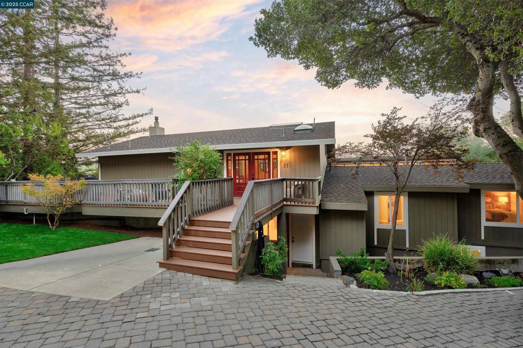 Discover a one-of-a-kind Orinda property offering 3,764 sq ft of beautifully updated living plus a 948 sq ft finished bonus space, perfect for flexible living. The main home features 2 bedrooms and 2.5 baths, including an oversized primary suite with spa-like bath, dual vanities, free-standing tub, stall shower, and walk-in closet. A dramatic great room with vaulted ceilings, wood floors, gas fireplace, and walls of sliders opens to expansive decks with stunning hillside views. The updated eat-in kitchen shines with new countertops, sink, hardware, designer lighting, and stainless appliances, complemented by an updated powder room and large laundry. Attached yet private, a renovated 2 bed/2 bath unit with its own entrance offers new floors, windows, doors, and a sleek open-concept kitchen/living/dining area—ideal for multi-generational living, in-laws, or rental income. The 948 sq ft finished lower level with full bath and kitchenette provides endless options—office, studio, gym, or game room. Wrap-around decks on both levels create seamless indoor-outdoor flow. With a long driveway lined in new pavers and a prime location moments from downtown Orinda, BART, freeway, hiking trails, and top-rated K-12 schools, this rare retreat is the perfect place to call home.