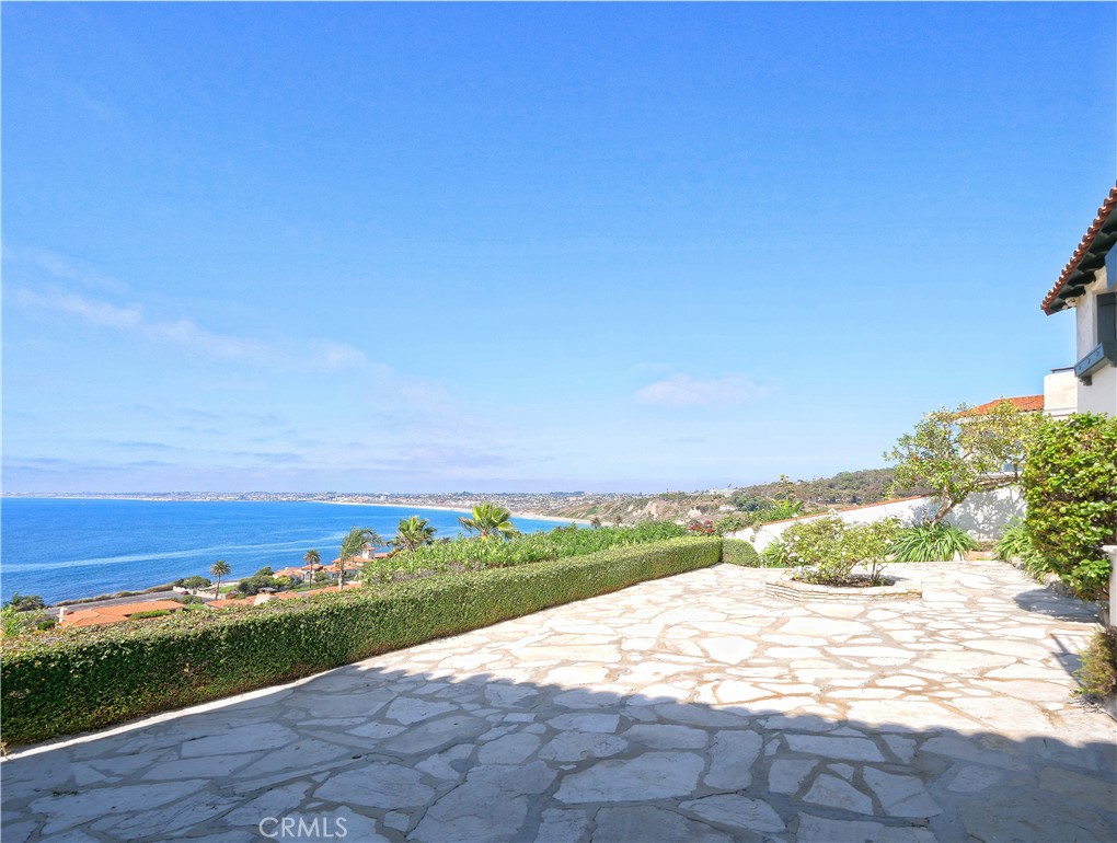 Panoramic views of the ocean, coastline, cities, and beach. One of the first few homes built in the Malaga Cove section of the Palos Verdes Estates, it has distinctive architectural features, such as beamed ceilings, tiled steps, unique fireplaces, railings, windows, and doors. This home boasts a gated front private yard. It features spacious, lovely, and flat outdoor living areas on both levels, complemented by a balcony that offers fantastic views, allowing you to enjoy the gorgeous weather and immerse yourself in the magnificent history of Palos Verdes Estates' development. It is conveniently near shopping, restaurants, banks, a post office, hiking trails, parks, and churches. A sketch of moving the kitchen upstairs is in the photos for your information only.