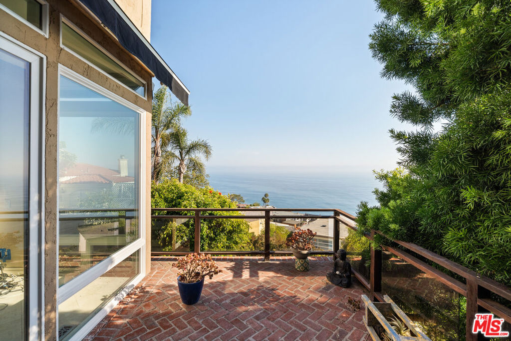 An excellent opportunity to update or customize, this charming home is situated on a quiet cul-de-sac in the hills of Laguna Beach and offers sweeping views of the Pacific Ocean and surrounding coastline. Large windows bring in natural light and showcase the scenery, while the open living and dining areas connect seamlessly to expansive decks for easy indoor-outdoor living. The functional floor plan includes a spacious primary suite, additional bedrooms for guests or office use, and multiple outdoor spaces. Terraced patios provide options for relaxing, dining, or gardening -- all with ocean breezes and panoramic vistas. This property is located just minutes from Laguna's beaches, galleries, restaurants, and shops, offering a balance of privacy and convenience in one of Southern California's most sought-after coastal communities.