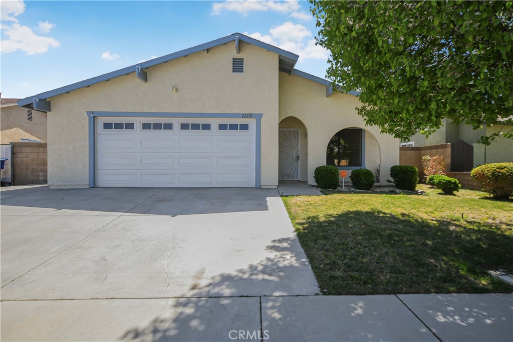 This beautifully renovated home is move-in ready and offers fresh updates throughout, starting with full interior paint that brings a clean, modern feel, paired with crisp new exterior trim paint for a polished look. The updated kitchen is a showstopper, featuring sleek quartz countertops, brand new stainless steel appliances, a new stainless steel sink, and a modern faucet—perfectly blending style and functionality. Brand new plank flooring flows through all common areas and bathrooms, while plush new carpet adds warmth to the bedrooms, ensuring comfort in every room. The upgrades continue with all-new plumbing and light fixtures, creating a cohesive and contemporary atmosphere throughout. Enjoy both formal and casual spaces with two separate living areas, a dedicated dining area, and a cozy family room complete with a gas fireplace. Central heat and air keep the home comfortable year-round, and the 2-car garage provides convenient parking and storage. The master bedroom is a private retreat with its own slider to the backyard patio, a tub/shower combo with glass doors, new toilet and faucets, and mirrored closet doors. Step outside to a large backyard enclosed by sturdy block walls, with a covered patio that overlooks the spacious yard—perfect for entertaining or letting the kids and pets run free. Located in a great neighborhood close to schools, parks, shopping, and more, this is a rare offering you won't want to miss. Come see this stunning home before it's gone!