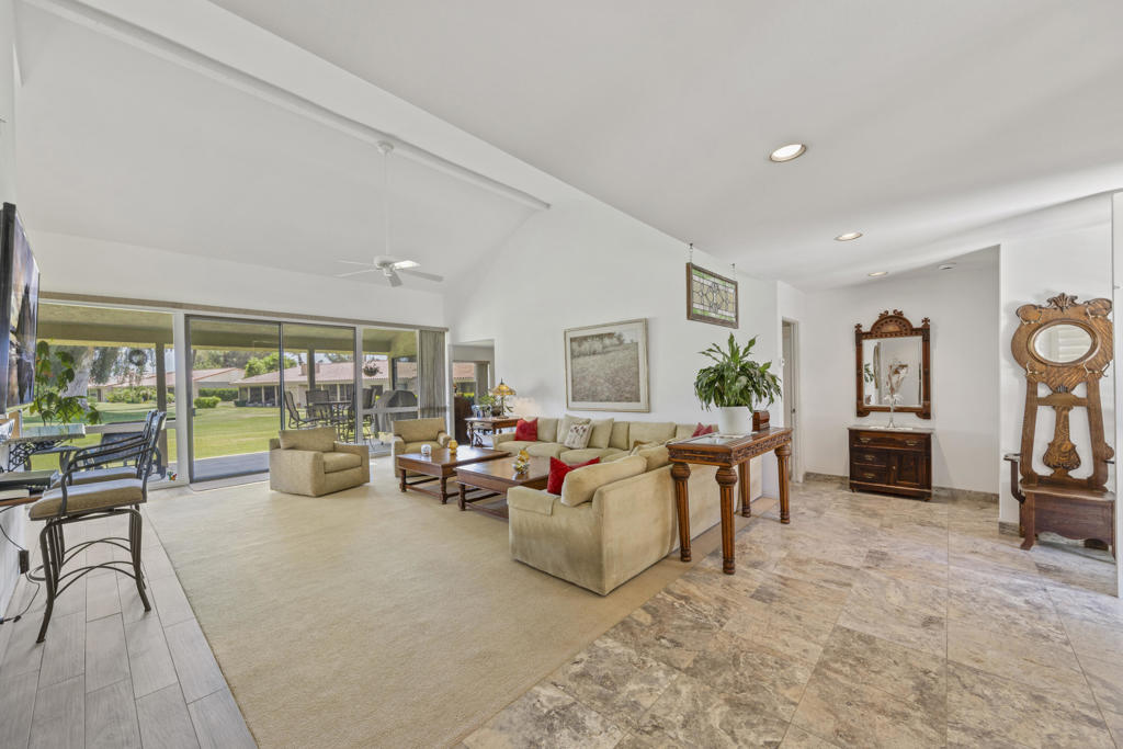 Discover this opportunity to own a spacious and inviting 3-bedroom, 3-bath condo in the desirable Montego West community within Bermuda Dunes Country Club. Spanning approximately 2,400 sq ft, this home features an expansive den/family room with a cozy fireplace-- easily convertible into a second primary suite. Enjoy generous living and dining areas with soaring vaulted ceilings and breathtaking views of the driving range, golf course, clubhouse, and mountains. A thoughtfully added office space sits just off the dining room for added functionality.The home is perfect for full-time living or a desert retreat. Montego West residents enjoy access to multiple pools, spas, and tennis courts. HOA fees include exterior maintenance, roof care, landscaping, trash service, and more. Located within the Imperial Irrigation District for lower electric rates and secured with 24-hour guard-gated access by Bermuda Dunes Country Club Security.
