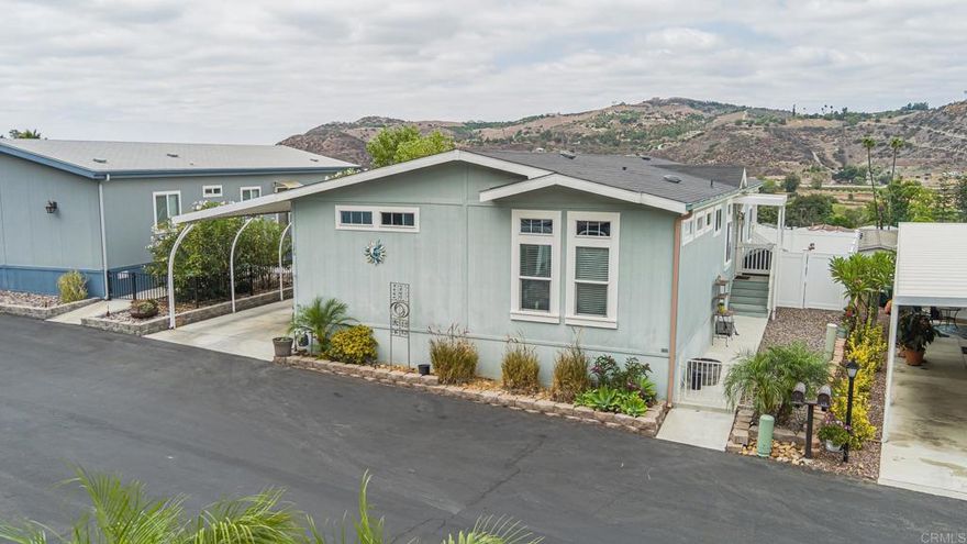 Upgrade to the ultimate living experience at Rancho Monserate Country Club with this custom designed home, many upgrades.... featuring a butlers pantry in the oversized utility room, master ensuite with a doorless walk in shower, and a separate soaking tub. Enjoy sunrise and sunset views from the living room, dining room and kitchen.  Low maintenance, fenced yard offers privacy. Enjoy the resort-lifstyle in this active 55 plus community in North County's best kept secret, Rancho Monserate Country Club.  You own the land, no space rent. Free golf, tennis pickleball, RV Storage, dog park, walking trails..many amenities and activities!