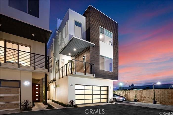 Contemporary living at its finest just minutes from the beach! Pristine interior design, rooftop ocean views and abundant amenities await you in this stunning Newport Heights Home. Located in the coveted Ebb Tide community, this tri-level home offers high ceilings, a downstairs bedroom with en-suite bathroom and 3 bedrooms on the third floor. The family room is pre-wired for the entertainment system with speakers on the ceiling. Complete with sophisticated upgrades and details, including all Thermador appliances, reverse osmosis water filter, wine fridge, automatic shades, nest systems and electronic toilet with bidet in the guest bathroom. Entertain in your massive chef’s kitchen with top-of-the-line appliances. Enjoy breathtaking sunsets from the rooftop deck. This particular unit is at the end of its street, so you have no neighbor on the west. Functionality meets luxury in this truly special home, including a two car garage with electric car plug in, a private community pool and spa.
