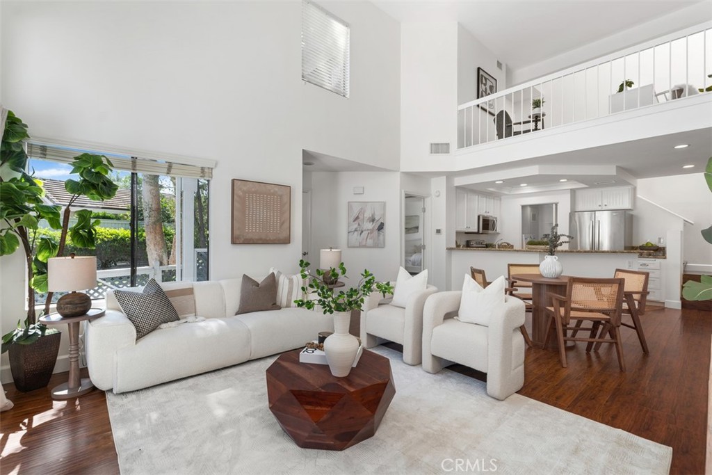 Welcome home to your picture perfect Woodbridge townhome! This tastefully upgraded and absolutely pristine 2 bedroom, 2 bathroom plus loft end unit, with no one above or below, has an enclosed front patio and is positioned in a fabulous spot facing the greenbelt, with views of the park. With its premium "inside the loop" location, you're just steps from the beautiful South Lake and many of the amenities Woodbridge is famous for. Primary bedroom with en suite bath on the first floor, with a bedroom, full bath and loft (could be enclosed as a third bedroom) on the second floor. Includes your own detached one car garage and additional permit parking in lot directly behind townhome. Residents of Woodbridge enjoy resort-style amenities including two scenic lakes with walking paths, sandy lagoons, multiple pools and spas, tennis courts, parks, and more—all within a welcoming, established community. Walk to award-winning Irvine Unified Blue-Ribbon schools, and enjoy convenient access to world-class shopping, dining, and entertainment. Plus, no Mello-Roos in America’s “Safest City” according to the FBI. Embrace year-round sunshine and the relaxed luxury of a Southern California lifestyle - this is the home you’ve been waiting for!