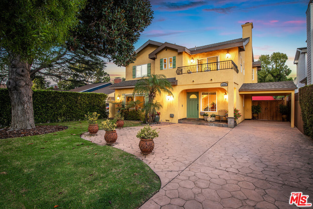 Welcome to this exquisite custom-built Tuscan-style residence, where timeless traditional design meets modern comfort. Offering 4 bedrooms, 4 bathrooms, and 3,206 sq. ft. of elegant living space, this home has been lovingly maintained in pristine condition for nearly two decades. The inviting entry opens to a gracious living room with a fireplace and a formal dining area, perfect for entertaining. A gourmet granite kitchen anchors the home with high-end stainless steel appliances, travertine floors, a walk-in pantry, and a charming breakfast nook filled with natural light. The romantic primary suite is a true retreat, featuring a spa-inspired bathroom with travertine finishes, soaking tub, separate shower, and a spacious walk-in closet. A versatile upstairs loft with balcony and a private downstairs guest suite provides flexibility for today's lifestyle. Throughout the home, rich details aboundhardwood floors, crown molding, recessed lighting, custom dual-paned windows with retractable screens, and designer finishes. Outdoors, enjoy resort-style living with a sparkling pool, lush landscaping, and multiple patio spaces ideal for gatherings. The two-car garage, previously used as a multi-purpose room, adds to the home's versatility, while the newly stamped concrete driveway offers ample parking. Ideally located just minutes from major studios, shops, and dining, yet tucked away in a peaceful neighborhood, this home captures the very best of Toluca Lake and Studio City living.