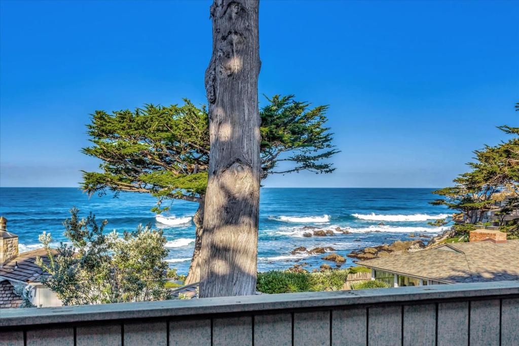 Exceptional white water views, spectacular sunsets and coastal luxury living in the coveted Carmel Point. Offering a world-class location, this charming home features 4 spacious bedrooms and 3 bathrooms (including a guest quarters perfectly suited as an ADU). Designed for both grand entertaining and everyday living there are three expansive balcony decks with ocean vistas gracing two levels of the reverse floorplan. Located on one of Carmel Points serene streets, this property is a rare find and being offered for the first time. At 3,020 feet situated on an expansive 6,500 square foot lot, it is close to downtown Carmel by the Sea, Ocean Beach, River Beach, Carmel Mission and Robinson Jeffers Tor House.