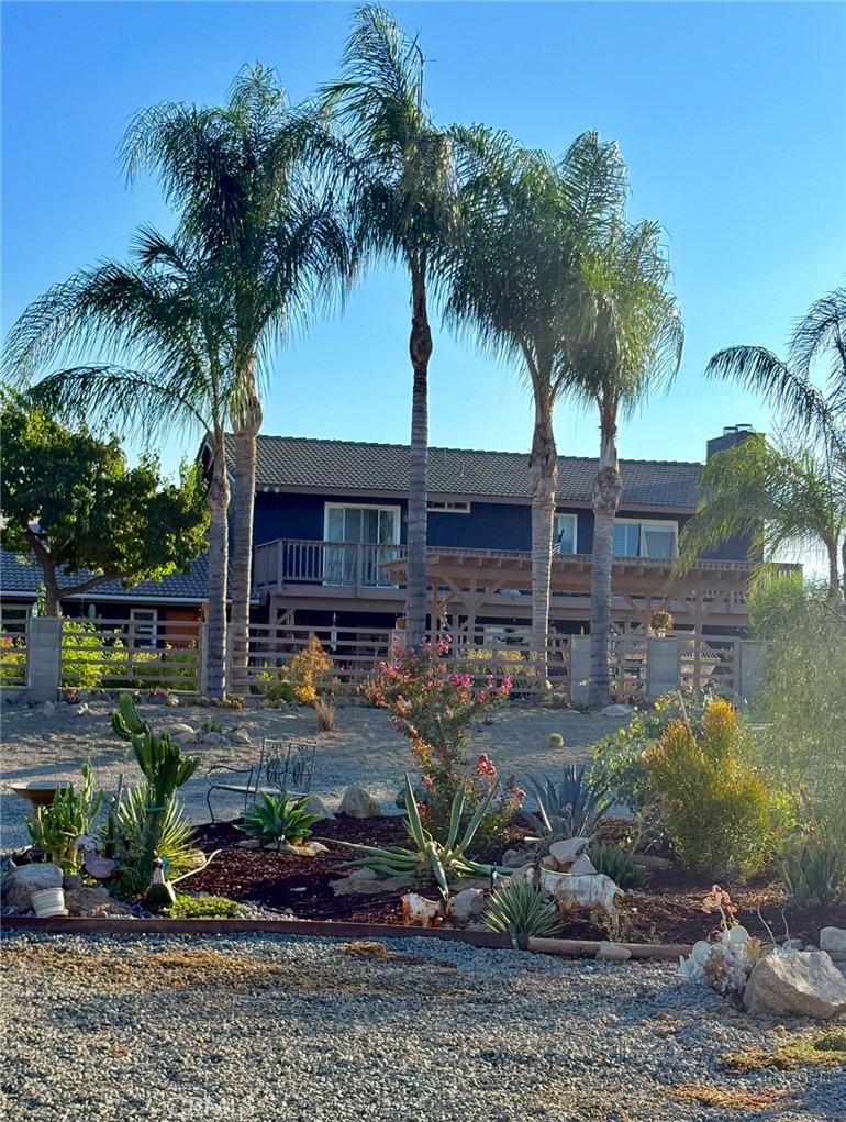MORE PHOTOS COMING SOON!
Equestrian lovers—welcome to your dream ranch at 18923 Crop Road in Riverside. This fully equipped horse property offers everything you need for riding, training, boarding, and living the country lifestyle, all while backing up to a protected nature reserve for ultimate privacy and open views.
The grounds feature two barns with brand new lighting and updated automatic waterers in the mare motel. There are five 12x12 stalls and five large in-and-out stalls approximately 28x14 feet each. The formal arena is approximately 120x100 feet, with an additional 100x50-foot arena, a 50x50 round pen, an 80x80 turnout, a 25x40 turnout, one covered turnout, and a spacious field turnout. A two-space wash area, elevated hay barn, two tack sheds, and a tractor barn that fits a full-sized truck complete the setup for both functionality and convenience.
After a long day outdoors, enjoy the comforts of a 5-bedroom, 3-bathroom home designed for relaxed living. The main level features tile flooring, while upstairs is finished with luxury laminate. Every upstairs bedroom includes its own private patio with views of the surrounding hills. Additional highlights include two walk-in closets, a tankless water heater, and a new electric entry gate.
For outdoor entertaining, the property offers a sparkling pool and jacuzzi, a large covered patio, two garden areas with fruit trees, a custom dog house, and a concrete RV pad with hookups.
This rare Riverside property is move-in ready and ideal for horse owners, animal lovers, and anyone seeking open space with modern comforts.