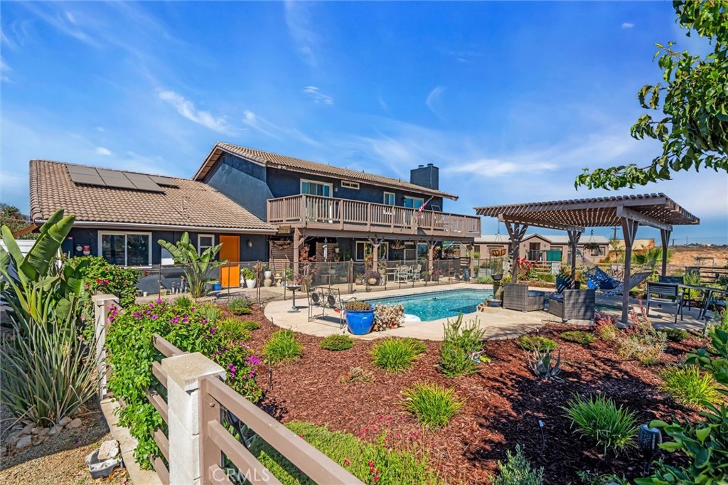 Equestrian lovers—welcome to your dream ranch at 18923 Crop Road in Riverside. This fully equipped horse property offers everything you need for riding, training, boarding, and living the country lifestyle, all while backing up to a protected nature reserve for ultimate privacy and open views.
The grounds feature two barns with brand new lighting and updated automatic waterers in the mare motel. There are five 12x12 stalls and five large in-and-out stalls approximately 28x14 feet each. The formal arena is approximately 120x100 feet, with an additional 100x50-foot arena, a 50x50 round pen, an 80x80 turnout, a 25x40 turnout, one covered turnout, and a spacious field turnout. A two-space wash area, elevated hay barn, two tack sheds, and a tractor barn that fits a full-sized truck complete the setup for both functionality and convenience.
After a long day outdoors, enjoy the comforts of a 5-bedroom, 3-bathroom home designed for relaxed living. The main level features tile flooring, while upstairs is finished with luxury laminate. Every upstairs bedroom includes its own private patio with views of the surrounding hills. Additional highlights include two walk-in closets, a tankless water heater, and a new electric entry gate.
For outdoor entertaining, the property offers a sparkling pool and jacuzzi, a large covered patio, two garden areas with fruit trees, a custom dog house, and a concrete RV pad with hookups.
This rare Riverside property is move-in ready and ideal for horse owners, animal lovers, and anyone seeking open space with modern comforts.