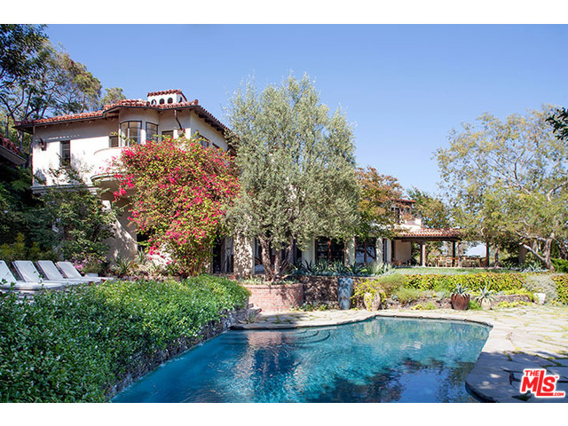 Museum quality restoration of a classic Bel Air estate situated on a promontory with unobstructed city to ocean views. Behind gates and down a private driveway, incredibly stylish and chic, this authentic courtyard Mediterranean features resort-like grounds and complete privacy. Spectacular living room with coffered wood ceilings, elegant pub/bar room, large screening room/theater, family room, gourmet commercial kitchen, breakfast room, office, and gym. Fabulous master suite overlooking head-on city views. French doors and windows throughout opening to outdoor loggia/dining pavilion, expansive lawn and pool, perfect for large scale or intimate entertaining. Complete separate guest house. One of the most exclusive addresses and sought after locations in Bel Air. Shown to pre-qualified clients only.