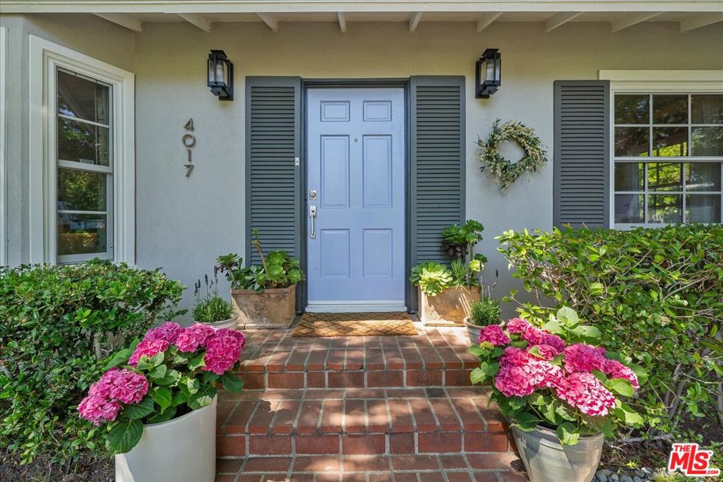 Welcome to an oasis of elegance and charm. This two bedroom, three bath refurbished home with an ensuite guest house sits on a substantial verdant lot in Palos Verdes Estates. You enter into a light filled living room with a fireplace that flows into a well-appointed dining room. The kitchen with its herringbone floors is very inviting with stainless steel appliances and an attached laundry and powder room/full bath. At the back of the house is an appealing, colorful family room with a sunlit wall of windows. The beautiful master bedroom has a walk-in closet, ensuite bathroom and a cozy seating area. Also included is a second lovely bedroom and a third bathroom. As you leave the house you walk across a stone patio into a magical guest house (450 sq.ft) with ensuite bath and a personal patio area. This is a "not to miss" property.