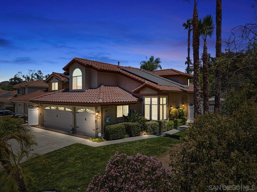 Welcome to your own private retreat at the end of a quiet cul-de-sac in North Escondido, where space, style, and privacy come together in all the right ways. This 4 bedroom, 3 bathroom home is tucked against open space with a lush, oversized backyard that feels like your own secret garden, perfect for entertaining, playing, or simply soaking up the peace and quiet. Inside, you’ll find soaring ceilings, brand new flooring, fresh paint, and an abundance of natural light that gives every room a bright, airy feel. The main level features a formal dining room and living room with dramatic vaulted ceilings, a beautifully updated kitchen that opens to a cozy breakfast nook and spacious family room with a stunning fireplace and views of the backyard. A full bedroom and bathroom downstairs offer flexibility for guests, or a home office, plus a large laundry room with extra storage. Upstairs includes three more bedrooms and two full bathrooms , including a spacious primary suite with high ceilings and great natural light.With a 3-car garage, leased solar, and no HOA or Mello Roos, this home offers incredible value in one of North Escondido’s most desirable pockets.