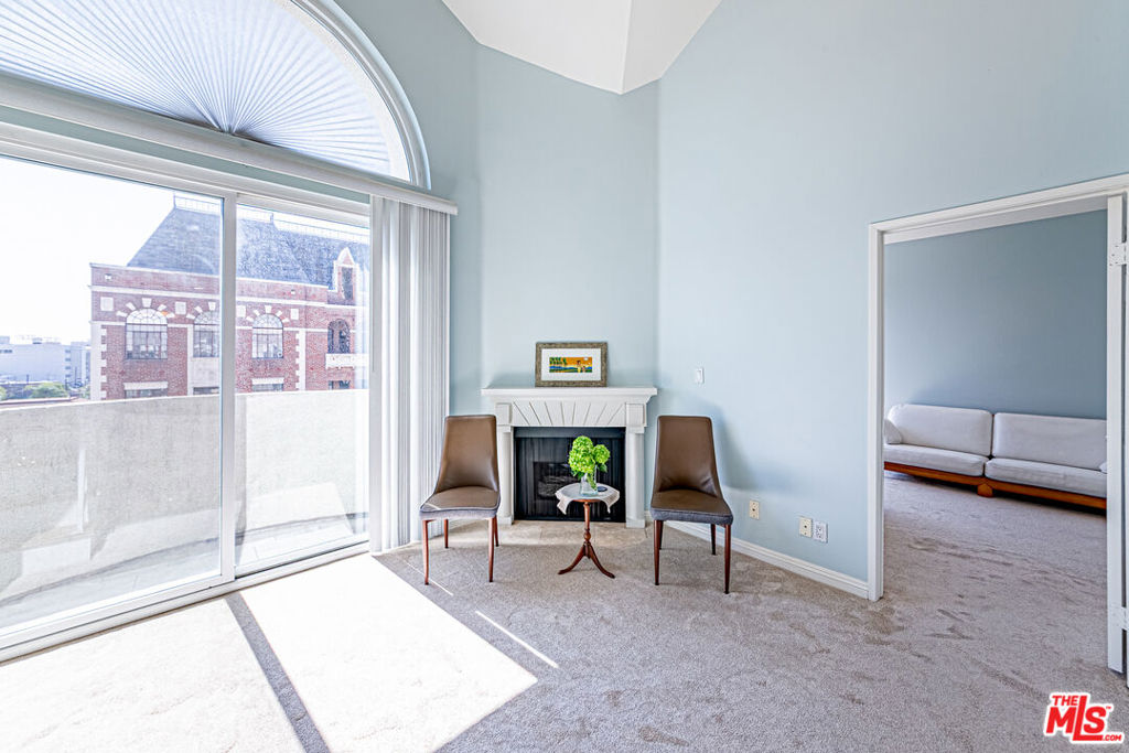 Located in one of Los Angeles' most desirable neighborhoods, this stunning two-story, top-floor end-unit condo offers an exceptional blend of modern elegance and urban convenience. Nestled between Mid-Wilshire and Koreatown and adjacent to historic Hancock Park, this move-in-ready residence features two spacious bedrooms, two fully renovated bathrooms, and a versatile loft den, all within one of the largest floor plans in the community. The main level features a bright and airy open layout with high ceilings, a classic fireplace, and direct access to a private balcony with sweeping views of the Koreatown skyline. The gourmet kitchen is appointed with granite countertops, updated cabinetry, all-new stainless steel appliances, and a convenient breakfast bar. The primary suite includes a luxurious en-suite bath and a generous walk-in closet, while the secondary bedroom is ideal for guests or a home office.Additional interior highlights include recessed lighting throughout, new engineered carpets, waterproof laminate flooring, fresh designer paint, and two assigned tandem parking spaces. Enjoy resort-style living with a wealth of community amenities : A rooftop swimming pool and Jacuzzi with 360 panoramic views of Downtown LA and the Hollywood Hills // A fully equipped fitness center with dry sauna and showers // 24-hour security, on-site property management, and ample guest parking // Located within walking distance to Metro stations, top-rated restaurants, shopping, and entertainment hubs such as Wilshire Corridor, DTLA, Larchmont Village, Paramount Studios, and Hollywood. The upcoming Metro D Line extension to Beverly Hills (expected 2025) adds even more long-term value. This home also sits next to Saint James' Episcopal School, one of LA's most prestigious private schools.With a Walk Score of 97 and Transit Score of 78, this home offers the perfect combination of comfort, accessibility, and lifestyle.Don't miss your opportunity to own this elevated urban sanctuary in the heart of Los Angeles. Schedule your private tour today.