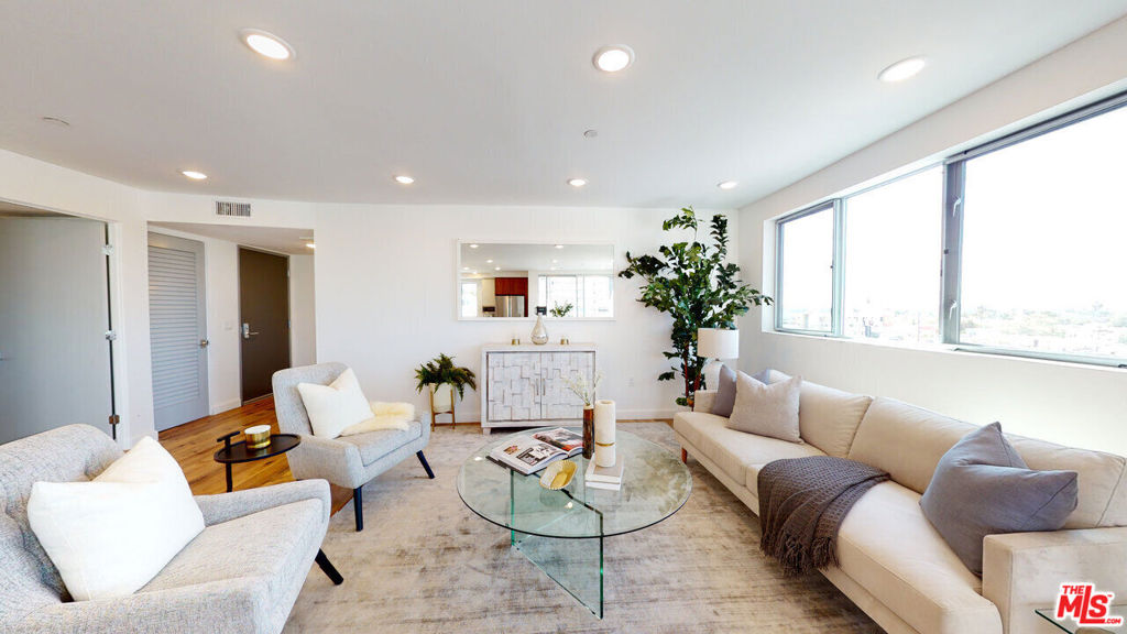 Welcome to Glenville Villas Modern Luxury Living in the Heart of the Westside!Experience brand-new contemporary living at Glenville Villas, a stunning luxury building offering beautiful south-facing city views from the rooftop deck. This thoughtfully designed residence features a Brazilian-designed kitchen with modern cabinetry, quartz stone countertops, a quartz backsplash, stainless steel appliances, and a large peninsula ideal for cooking and dining.The open floor plan is filled with natural light, creating the perfect space for relaxing or entertaining. Enjoy dual private balconies one off the living room and one off the primary bedroom providing seamless indoor/outdoor living. The primary bedroom includes a custom Brazilian walk-in closet with premium woodwork, and the unit is equipped with LED lighting and an in-unit washer/dryer for ultimate convenience.Residents enjoy access to a furnished rooftop deck with panoramic city views, reserved underground parking with electric vehicle chargers, and a prime location just steps from shops, markets, and restaurants along Pico Blvd, and a short walk to Beverly Dr. and Beverly Hills for world-class dining and entertainment.Pet inquiries welcome. Easy to show by appointment.