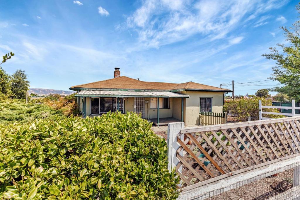 Whether you've been longing to raise horses, welcome goats and chickens, or craft a sprawling garden oasis, the possibilities are endless here. This charming 2 Bed 1 Bath home offers nearly 1 acre of fully fenced land, making it the perfect canvas to realize your country dreams. Imagine the sunny afternoons in your sprawling backyard, with room to build a tack shed, pasture stalls, or greenhouse. Your children could play outside, roaming freely, your pets could explore safely, and your family could comfortably gather as you host family BBQs under the shade of fruit trees. Located just minutes from downtown Gilroy, you're close to shopping, restaurants, award winning wineries, and the amenities of the city. Easy access to Hwy 101 puts Silicon Valley and the greater Bay Area all within comfortable reach, when needed, then return home to the peace of rural living. Property features a detached (non conforming) cottage, ~775 SqFt, with 1 Bath and 1 Bed adjoined to a Kitchenette/Living area, perfect for multi generational families or to rent out as potential source of income. Income opportunity also possible by utilizing the abundance of outdoor space as a venue for events & large gatherings, like a large wedding recently held on site (see pics).