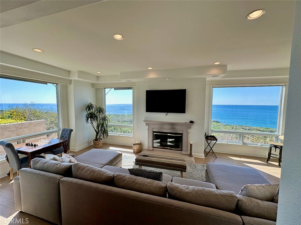 Welcome to 34385 Dana Strand Road #A – A Coastal Sanctuary
Perched at the edge of the world, this stunning 3-bedroom, 2.5 bathroom home offers breathtaking panoramic views of the ocean, coastline, and Catalina Island. Thoughtfully remodeled, this over 3,000 sq. ft. retreat is the epitome of comfort and tranquility.
Wake up to uninterrupted ocean vistas and the beauty of the Headlands open space. The light-filled living room provides a front-row seat to the sea, while the kitchen—featuring stone countertops, stainless steel appliances, and both formal and casual dining areas—is designed for both function and style.
The expansive ocean-view master suite is a true haven, opening to a spa-like bathroom with a soaking tub and a separate rain shower. Two additional guest rooms and a full bath complete the upper level, offering comfort and privacy for family or visitors.
Just moments from world-class resorts, including the Ritz-Carlton, Waldorf Astoria, and Montage Resort, as well as Dana Point Harbor, this home is perfectly situated to enjoy the best of coastal living.
Experience the beauty, serenity, and luxury of Dana Point—your oceanfront escape awaits.